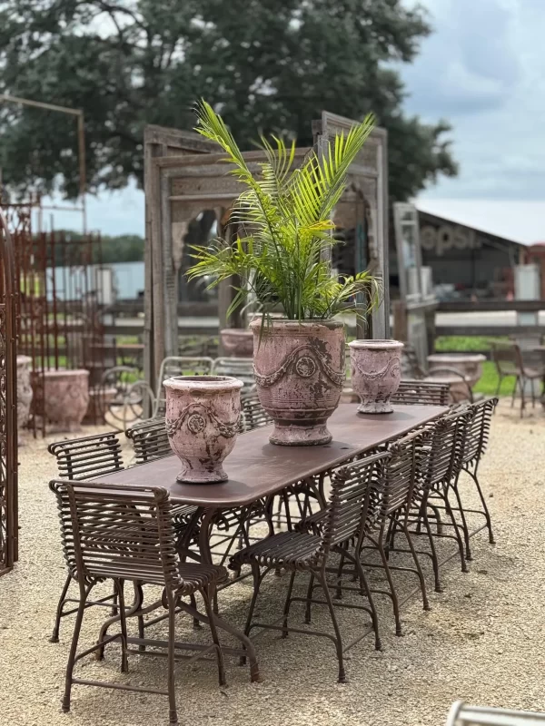 Outdoor French garden decor, vintage-inspired long table, 10-seater with Anduze pottery and handwrought iron garden chairs.